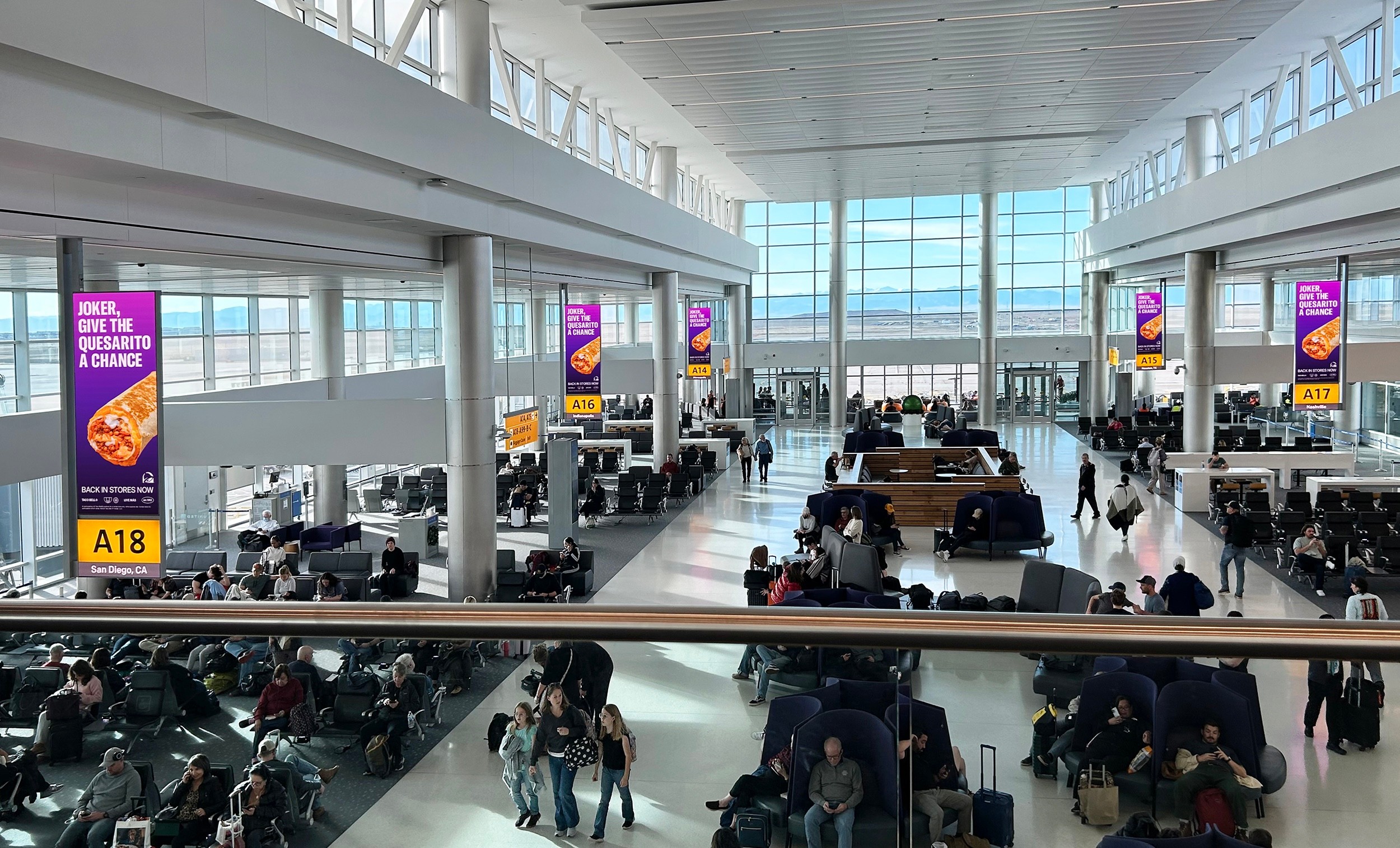 Transit signs saying "Joker Give the Quesarito a chance!" 